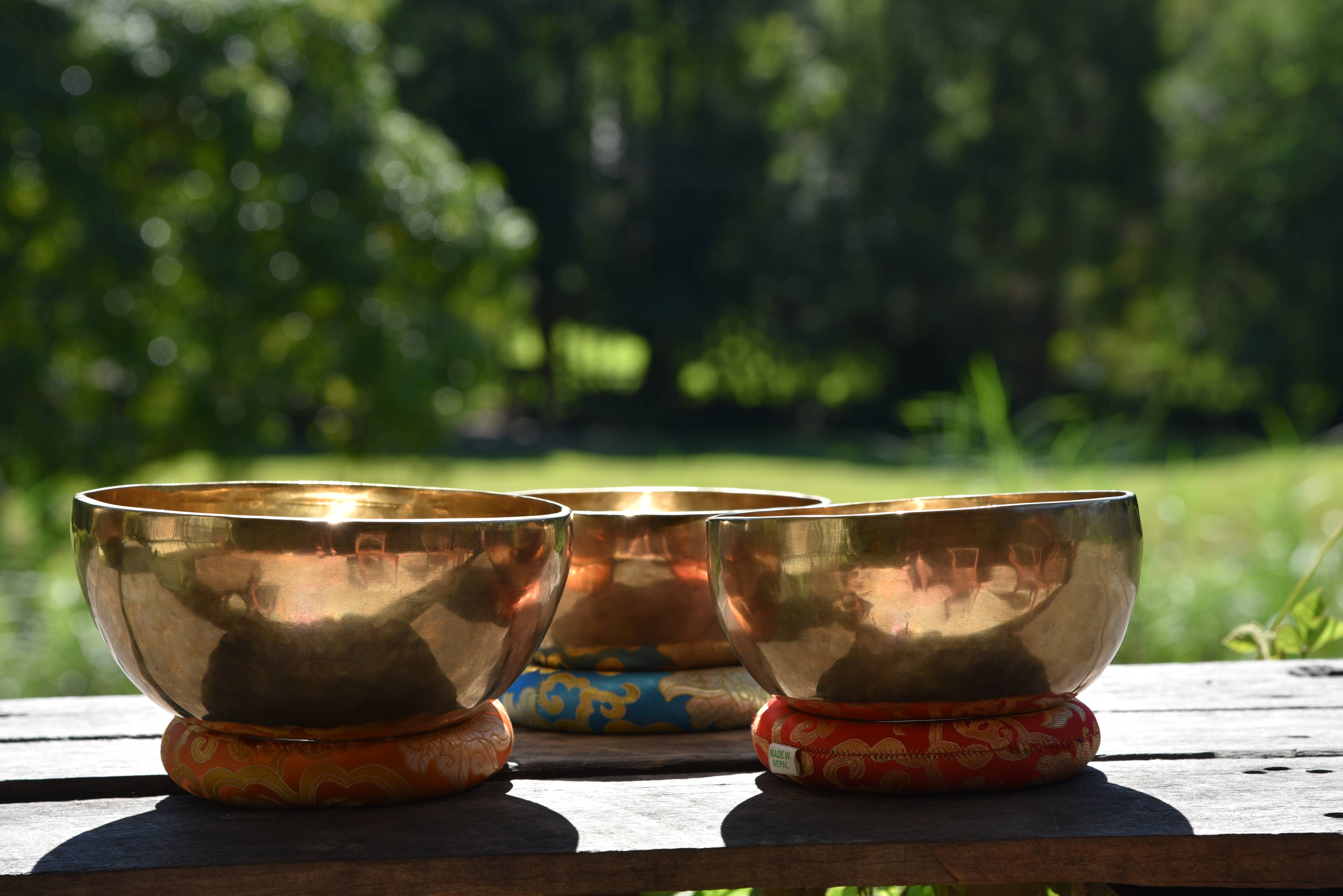 Handcrafted bowls on traditional ceremonial cushions